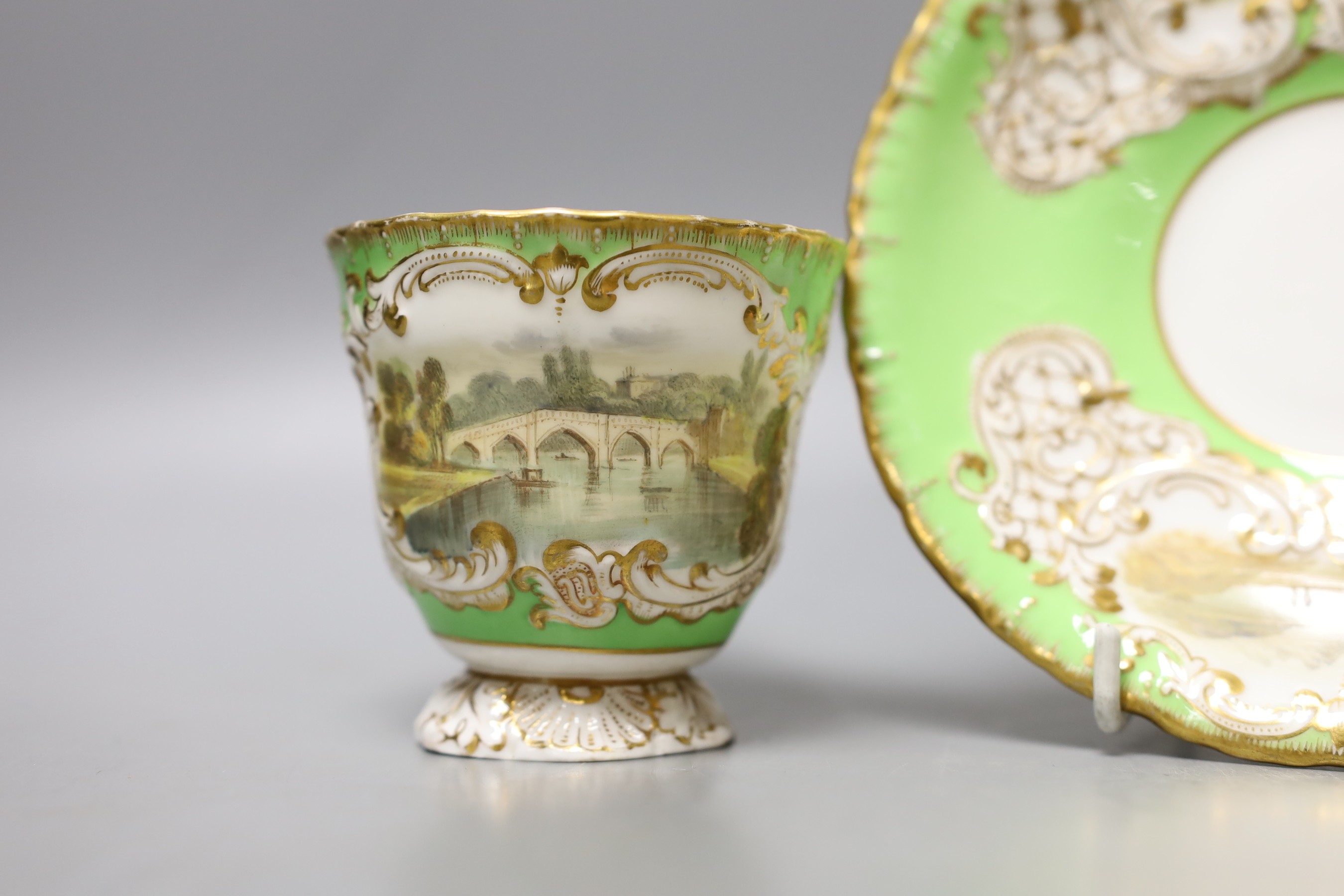 Copeland and Garrett fine topographical pedestal coffee cup and saucer with green ground painted with Richmond on the cup and Loch Ness and Warwick - 9cm tall